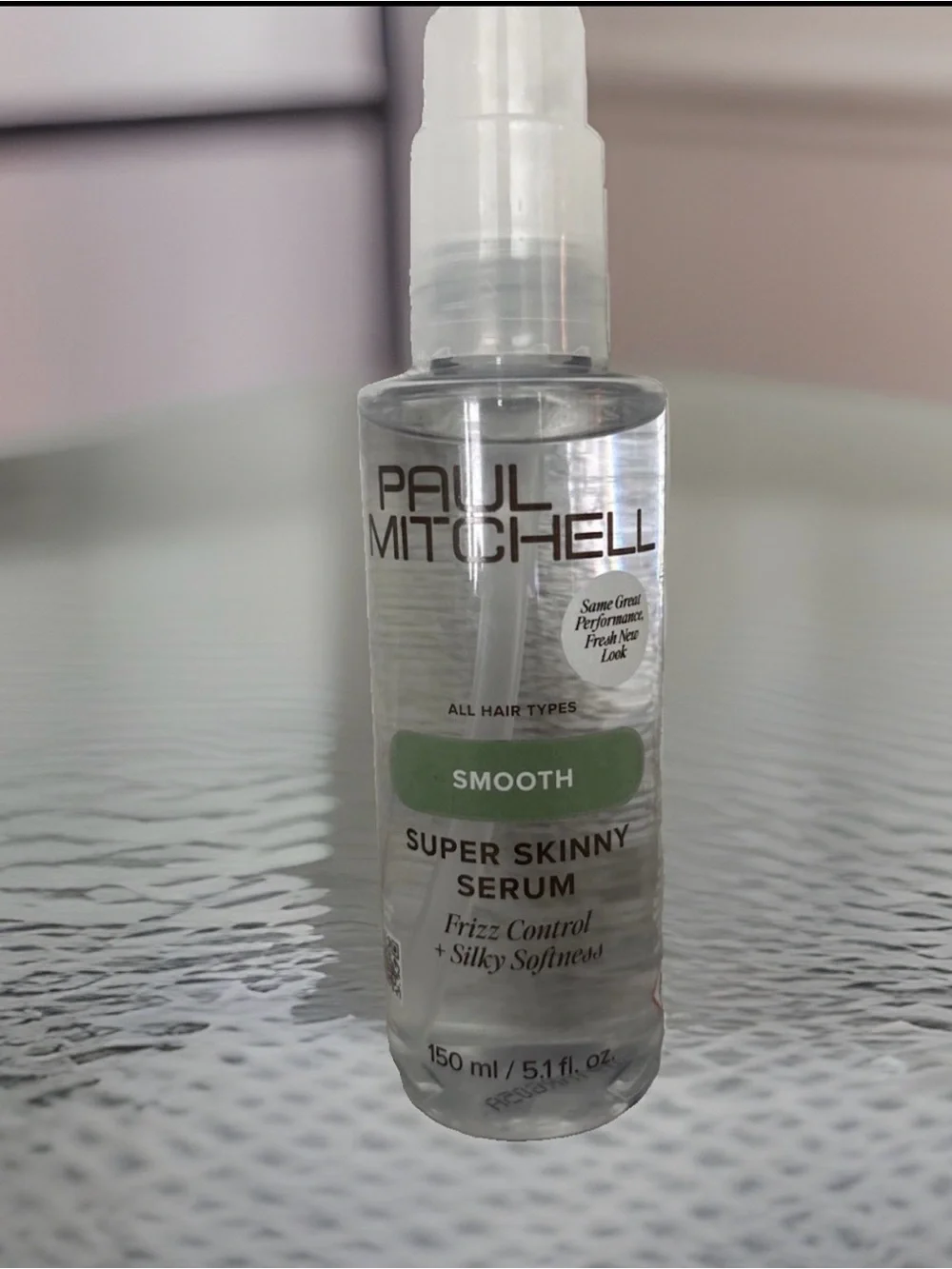 Paul Mitchell Smooth Super Skinny Serum Clear Bottle with Green Label